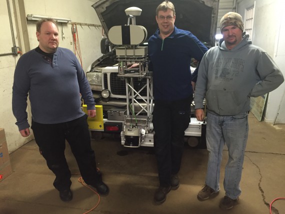 Programmer Jesper Engberg of BARRA, Sweden, Per Arne Pettersson of LKO Teknik AB, Sweden and Keith Sykes of L-KOPIA, Inc. in L-KOPIA’s Crown Point, IN Garage. Please note the third (3) LMS laser on the Excursion bumper (new concept). 