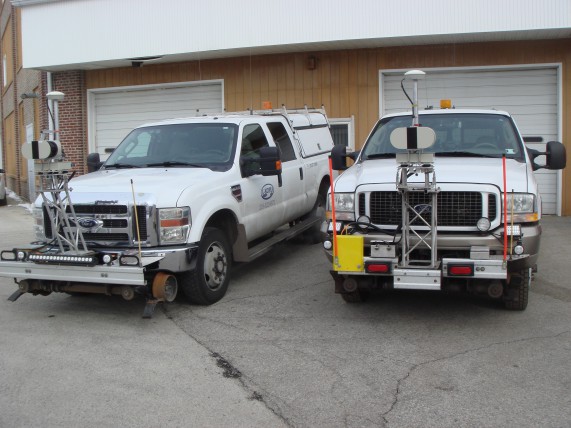 The two L-KOPIA Laser Trucks parked outside the L-KOPIA Garage and Shop in Crown Point, Indiana. The picture is taken before we started the upgrades on Feb. 4th, 2016.