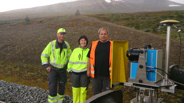 JBV Engineering personnel at a quick stop on the Arctic Circle (monument and some snow behind the group). From left Bjørn Biribakken, Janicke Oskarsen and Frank Woldsund.