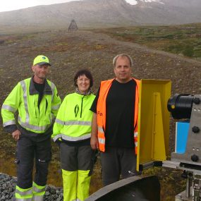 JBV Engineering personnel at a quick stop on the Arctic Circle (monument and some snow behind the group). From left Bjørn Biribakken, Janicke Oskarsen and Frank Woldsund.